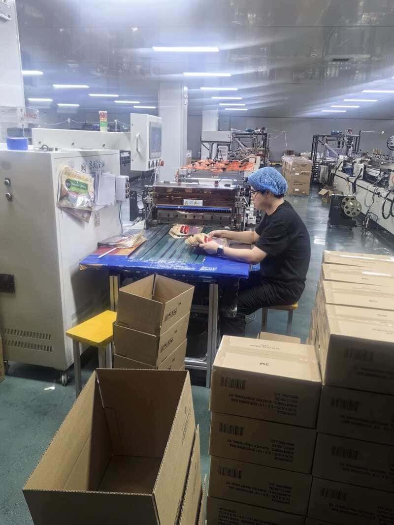 Worker packing finished pouches